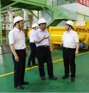 Delegation viewing robotic welding and machining operations